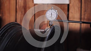 car wheel repair in auto workshop, closeup view in tire shop