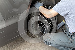 Car wheel repair shop outdoor ground . Seasonal winter tyre change at workshop. Vehicle tire repair, inspection and