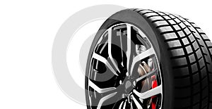 Car wheel with sleek black spokes and red caliper isolated