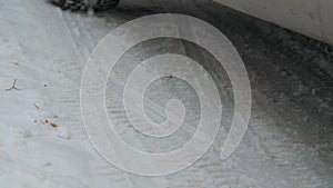 Car wheel is spinning while driving. Close up car moving in the snow. Car movement