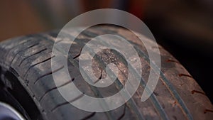 Car wheel with tire rotating closeup