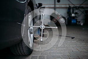 Car wheel with wrench, tire service concept
