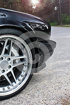 Car wheels close up on a background of asphalt. Car tires. Car wheel close-up. for advertising (for advertising)