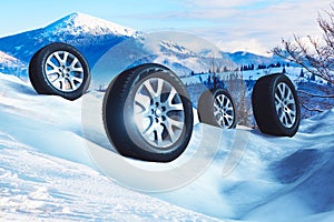 Car wheels with offroad winter tyres on snow