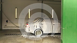 Car in white foam at the car wash photo