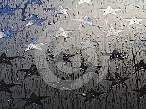 Car window with stars in the rain