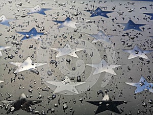Car window with stars in the rain