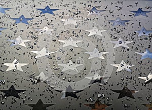 Car window with stars in the rain