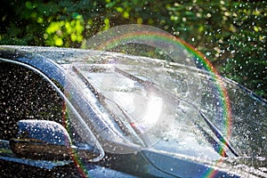 Car windshield with rain drops and frameless wiper blade