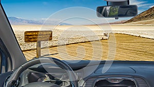 Car windshield with view of Badwater Basin, Death Valley, USA