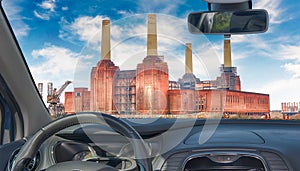 Car windshield with view of Battersea Power Station, London, UK