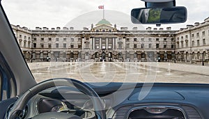 Car windshield with view of Somerset House, London, UK