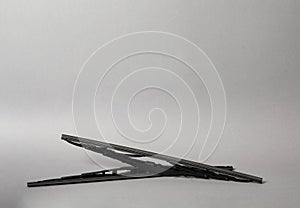 Car windshield wipers on grey background. Space for text