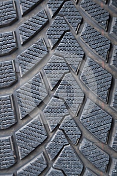 Car winter tire detail closeup, used car tires texture