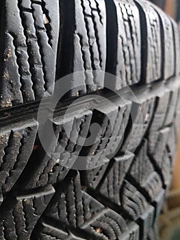 Car winter tire pattern close-up