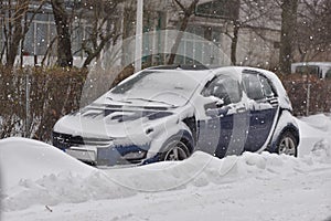 Car with winter tires on the snow covered road