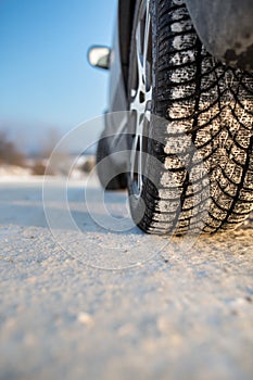 Car with winter tires on a snowy road