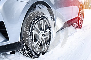 Car with winter tyres in a snowy road