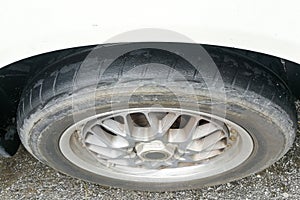 Car with worn bald tire unsafe and poses accident risk