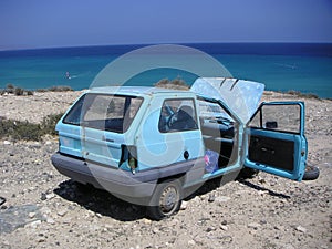 Car wreck on sea beach