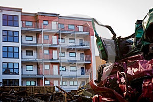 Car wreck yard with residential building in close proximity