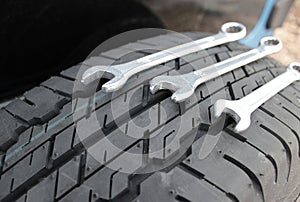 Car Wrenches For Wheel Mounting On A Spare Tire Closeup Angle View