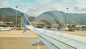 CARACAS, VENEZUELA - 2022: Airplane window view of Simon Bolivar Airport, Maiquetia - Venezuela.