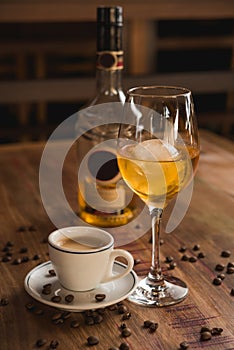 Carajillo cocktail, Spanish drink with 43 and coffee, with wooden table