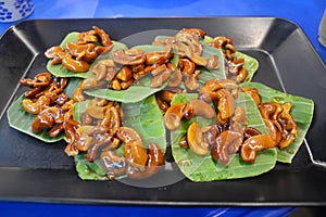 Caramel cashew nuts on banana leaves, Thai southern thailand traditional snack