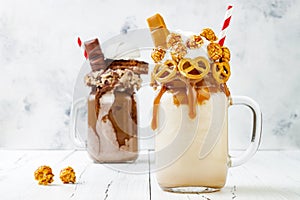 Caramel and chocolate crazy freakshake, milkshakes with brezel waffles, popcorn, marshmallow, ice cream and whipped cream.