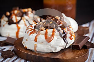 Caramel and chocolate Pavlova meringue cake photo