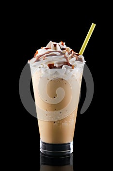 Caramel milkshake isolated on black
