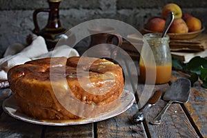 Caramel monkey bread. Apple pie with brown sugar and cinnamon on a wooden background. Autumn baking. Homemade sweets. Rustic style