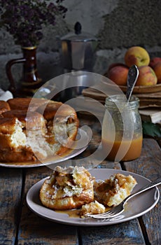 Caramel monkey bread. Apple pie with brown sugar and cinnamon on a wooden background. Autumn baking. Homemade sweets. Rustic style