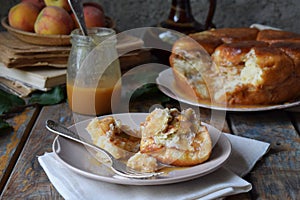 Caramel monkey bread. Apple pie with brown sugar and cinnamon on a wooden background. Autumn baking. Homemade sweets. Rustic style