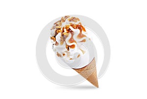 Caramel nuts vanilla ice cream in waffle cone on a white isolated background