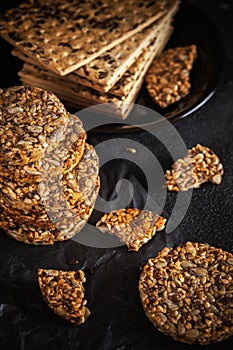 Caramel peanut brittle from sunflower seeds and sesame seeds and fitness cookies with flax seeds