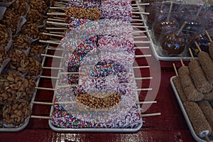 Caramel peanut marshmallow, red candy marshmallow with white coconut and marshmallow with rainbow sprinkles