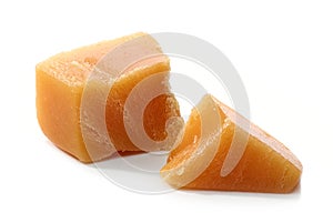 Caramel pieces on white background