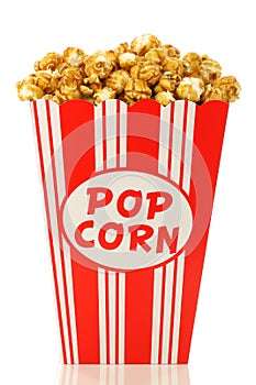 Caramel popcorn in a decorative paper popcorn cup