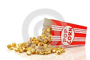 Caramel popcorn in a decorative paper popcorn cup