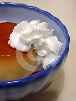 Caramel pudding with whipped cream
