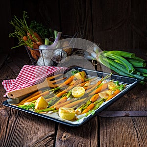 Caramelised carrots, spring onions and baked potatoes