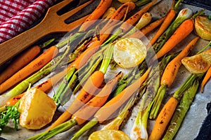 Caramelised carrots, spring onions and baked potatoes