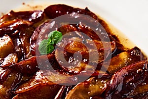 Caramelized apples with spices in white plate. Can be filling for pie or crumble and served over French toasts or