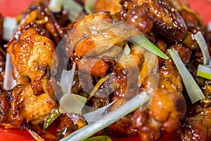 caramelized asian chicken wings with selective focus