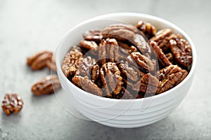 Caramelized or candied pecans photo