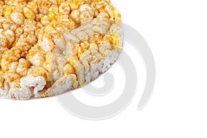 Caramelized corn cakes. Puffed whole grain crispbread isolated on white background. Close-up