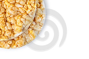 Caramelized corn cakes. Puffed whole grain crispbread isolated on white background. Close-up