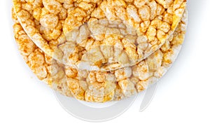 Caramelized corn cakes. Puffed whole grain crispbread isolated on white background. Close-up